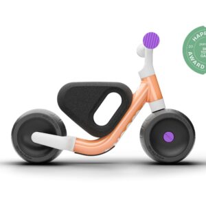 woom WOW self-balancing bike in pop peach, side view